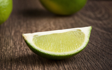 Sticker - Fresh lime on wooden background