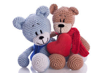 two teddy bears with red  heart pillow love