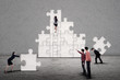 © Creativa Images - Business team build puzzle together