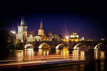 Night Shot Of Charles Bridge And River In Prague