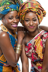 Wall Mural - Two African fashion models on white background.