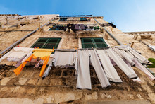 Drying Laundry By Hanging It On The Rope From The Window