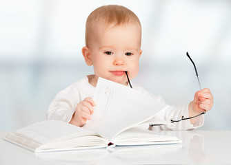 Wall Mural - funny baby reading a book