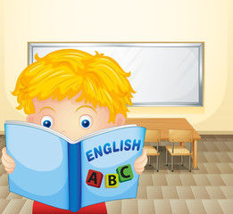 Aufkleber - A boy reading a book inside the classroom