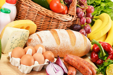 Fototapete - Assorted grocery products including vegetables fruits wine bread