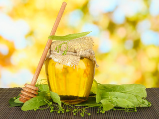 Poster - Jar of honey with flowers of lime,