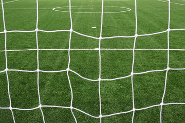 Wall Mural - soccer net on green grass