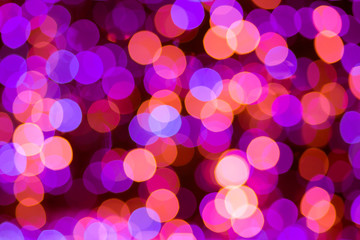 Festive purple and pink blur bokeh use for holiday backgrounds.