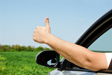 Man Inside Car Showing Thumb Up