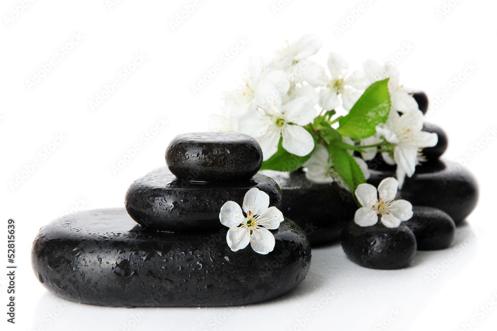 Spa stones and white flowers isolated on white
