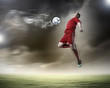 © Sergey Nivens - football player striking the ball