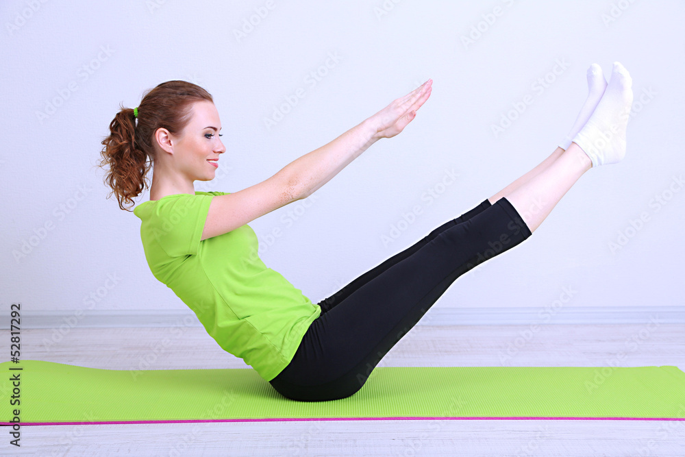 Portrait of beautiful young woman exercises