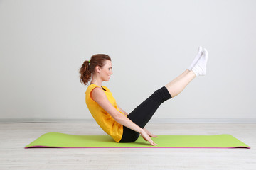 Portrait of beautiful young woman exercises