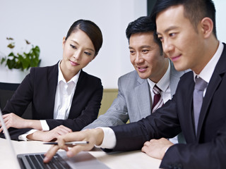 asian business people working together in office