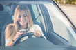 © william87 - Young Woman Sending Messages while Driving