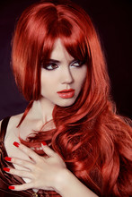 Red Hair. Fashion Girl Portrait With Long Curly Hair Isolated On