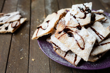 Wall Mural - thin crispy cookies with chocolate sauce