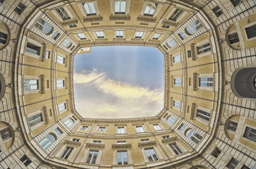 Wall Mural - Square between the buildings with beautifull sky.