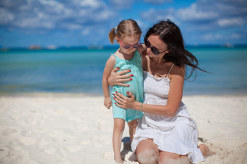 Mother and her little daughter at tropical beach