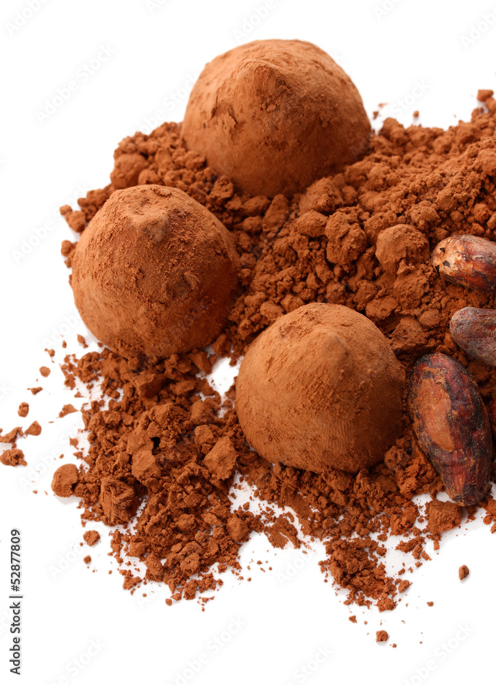 Chocolate truffles and cocoa isolated on white