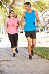 Wall Mural - Couple Running On Suburban Street