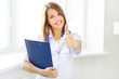 © Anton Maltsev - Female doctor showing thumbs up