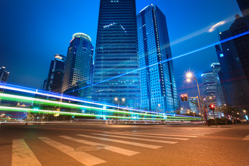 urban roads car light trails of modern buildings