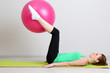 © Africa Studio - Portrait of beautiful young woman exercises with gym ball