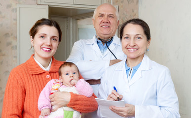 Wall Mural -  mother with three months baby and pediatrician doctors