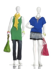 Wall Mural - female clothing in jeans with scarf, bag on two mannequin