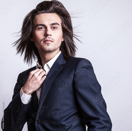 Fototapeta na wymiar Portrait of handsome long-haired stylish man.