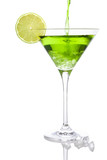 Fototapeta Dziecięca - Pouring a green cocktail into a martini glass