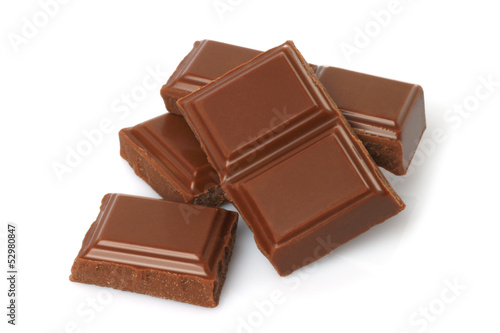 Fotografie, Obraz Broken milk chocolate bar isolated on white background .