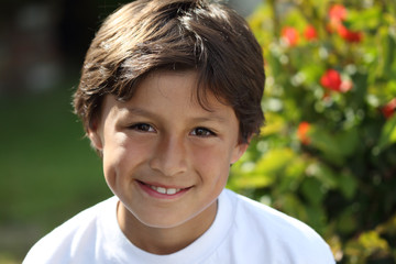 Young smiling boy in the park