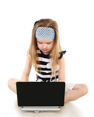 Wall Mural - Cute little girl with laptop isolated