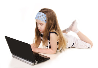 Wall Mural - Cute little girl with laptop isolated