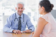 © WavebreakmediaMicro - Attractive doctor sitting in front of patient