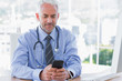 © WavebreakmediaMicro - Doctor using his smartphone