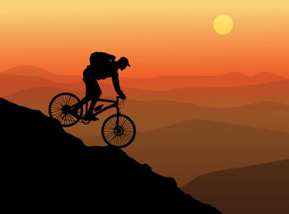 Silhouette of a cyclist with sunset background