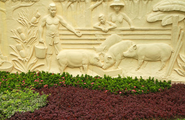 Wall Mural - Traditional Thai style sculptures of farmer