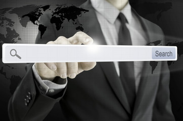 Wall Mural - business man pointing at search bar on virtual screen