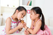 © WONG SZE FEI - Asian girls eating ice cream