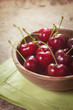 fresh cherries in a wooden bowl