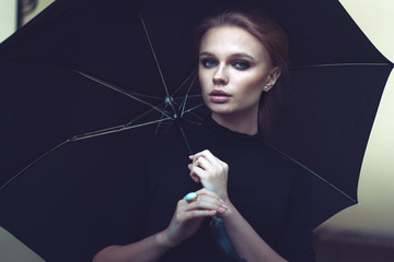 Beautiful girl portrait with umbrella outdoor