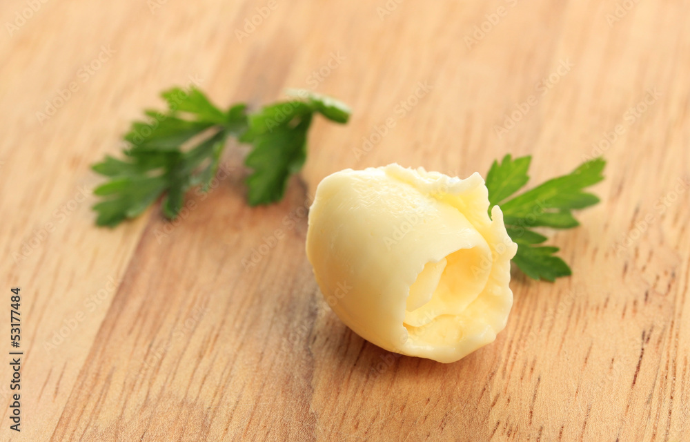 Butter curl on wooden table