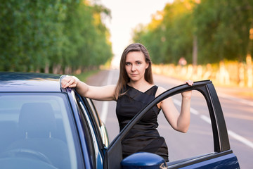 Wall Mural - Beautiful businesswoman near her car