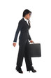 © wong yu liang - asian indian business woman full length walking with a suitcase