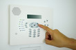 © voraphong pirawd - Setting home security alarm