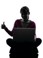 Wall Mural - woman thumb up computing laptop computer silhouette