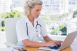© WavebreakmediaMicro - Nurse in her office working on her laptop